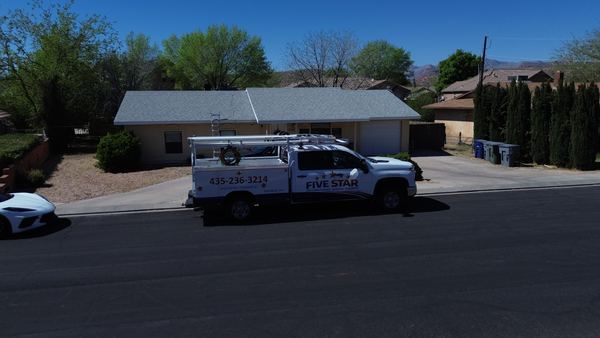 Drone aerial of a Five Star service truck at a residential home
