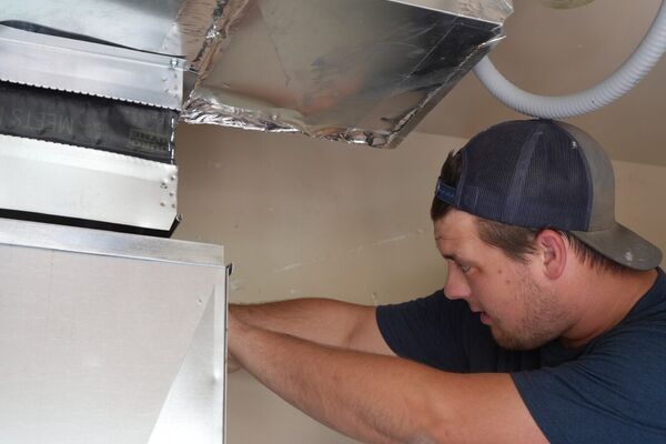 Five Star technician installing ductwork and an air handler in St. George, Utah