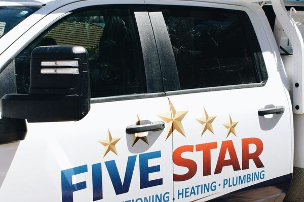 Close-up of the Five Star Air Conditioning, Heating & Plumbing service truck wrap in St. George, Utah