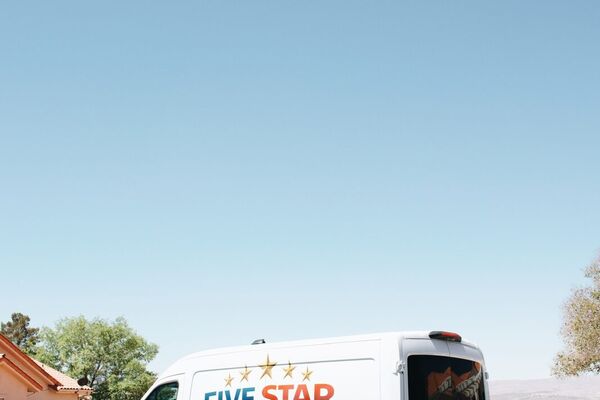 Five Star technician servicing a commercial rooftop package unit in St. George, Utah