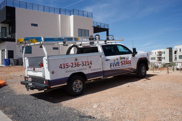 Five Star service truck parked at a modern Southern Utah home